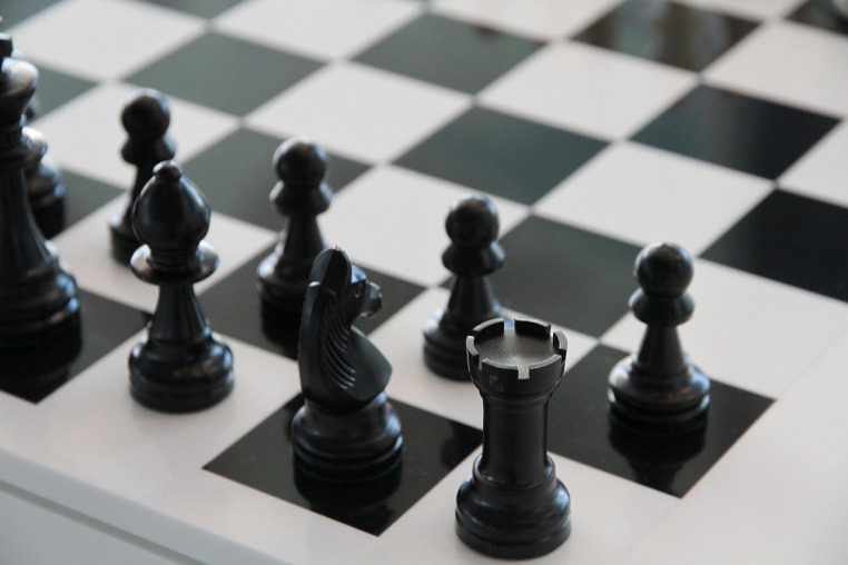 chess board with Castle, knight, bishop and pawn pieces